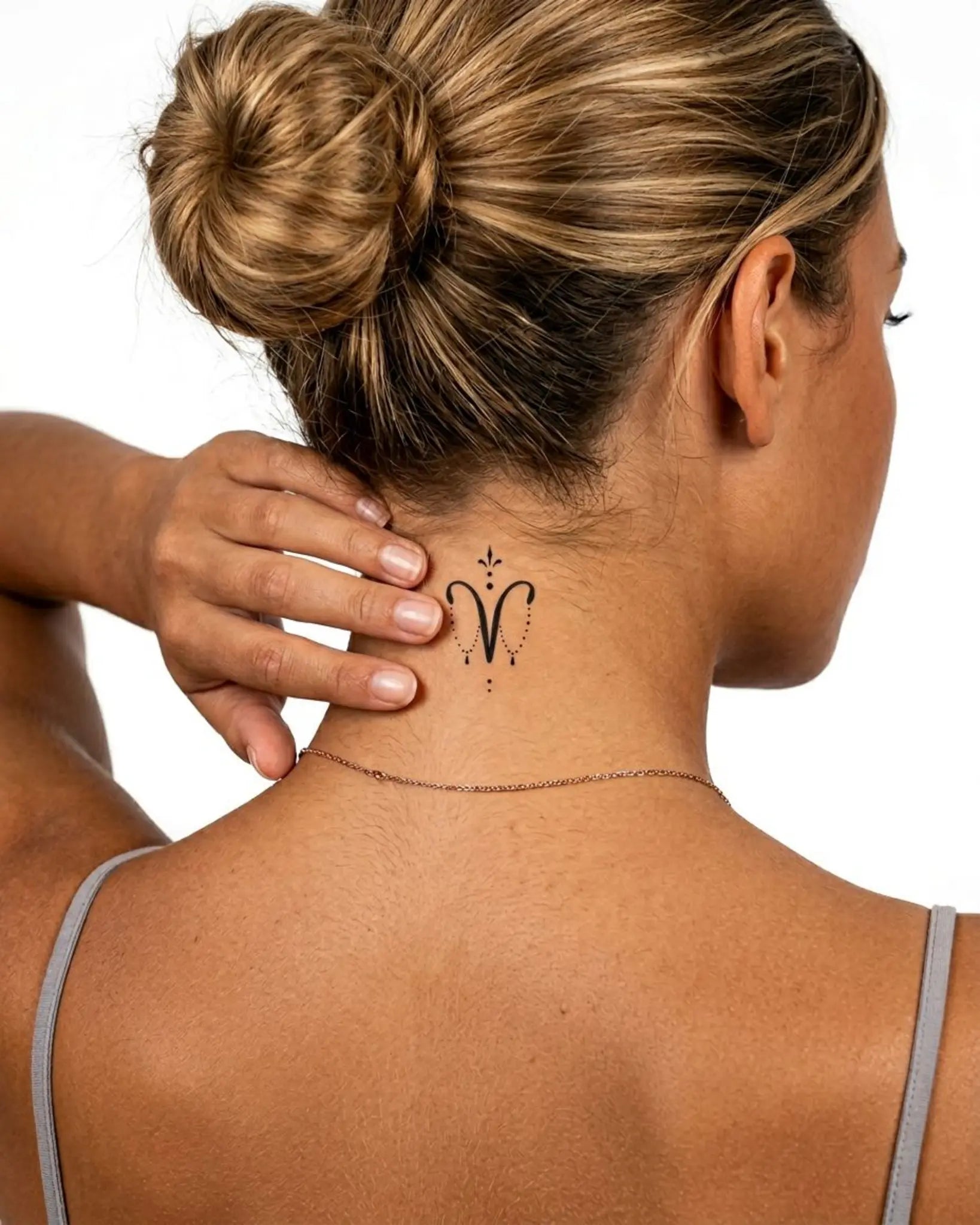 INKY Aries Charm semi-permanent tattoo applied on a woman – 2 x 2 in (4x4 cm) design, realistic ink look, lasts 10 days