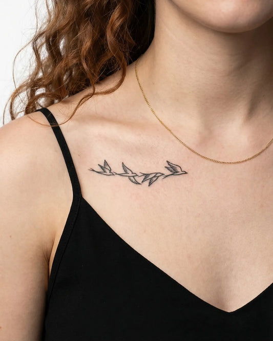 INKY Bird Flight semi-permanent tattoo applied on a woman – 2 x 4 in (6x10 cm) design, realistic ink look, lasts 10 days