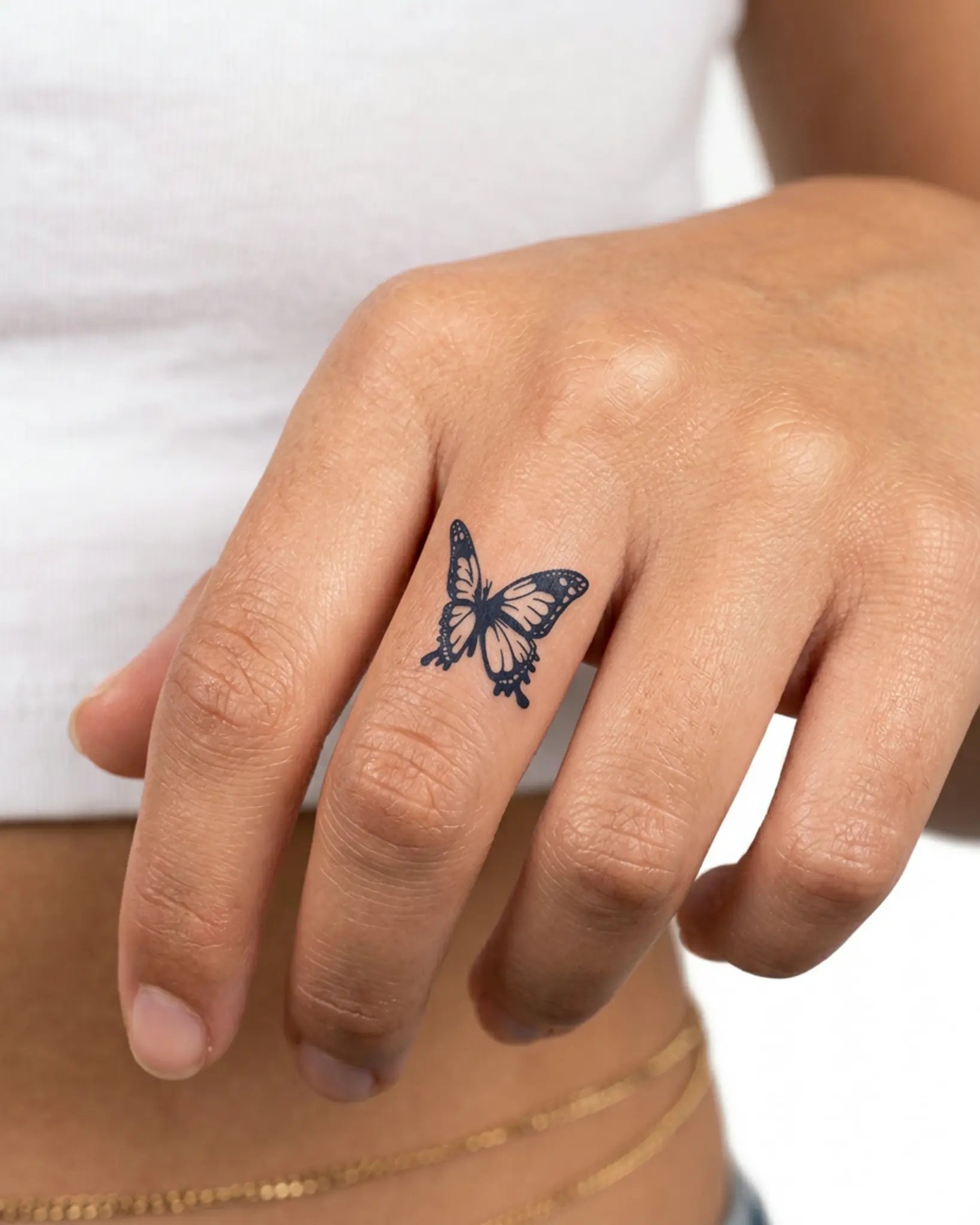 INKY Ink Butterfly 2 semi-permanent tattoo applied on a woman – 0.5 x 0.5 in (1x1 cm) design, realistic ink look, lasts 10 days