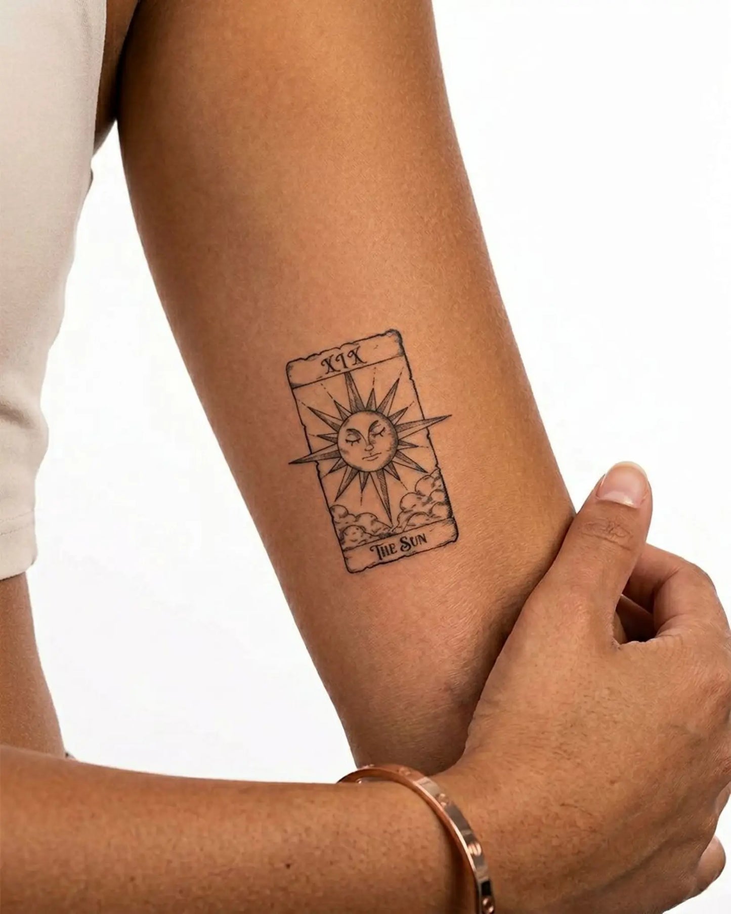 INKY The Sun Tarot semi-permanent tattoo applied on a woman – 3 x 4 in (7x10 cm) design, realistic ink look, lasts 10 days