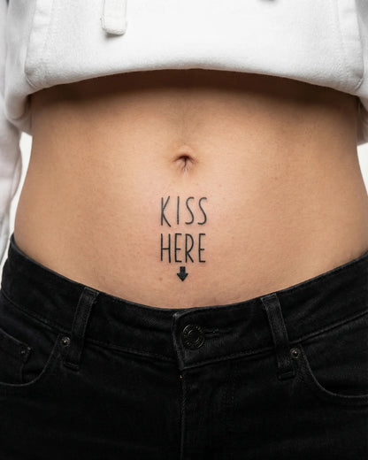 INKY Kiss Here! semi-permanent tattoo applied on a woman – 2 x 2 in (4x4 cm) design, realistic ink look, lasts 10 days