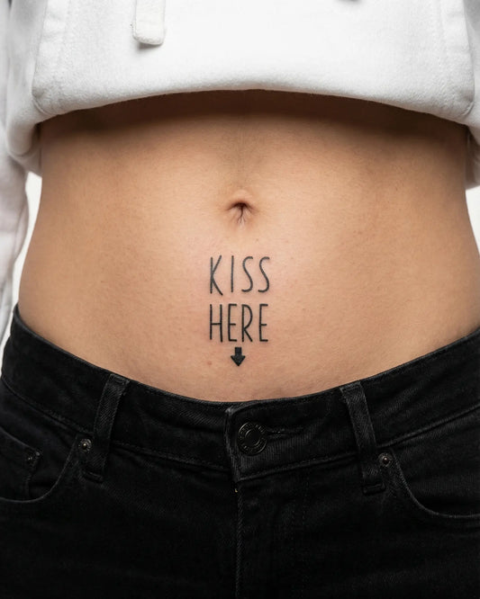 INKY Kiss Here! semi-permanent tattoo applied on a woman – 2 x 2 in (4x4 cm) design, realistic ink look, lasts 10 days
