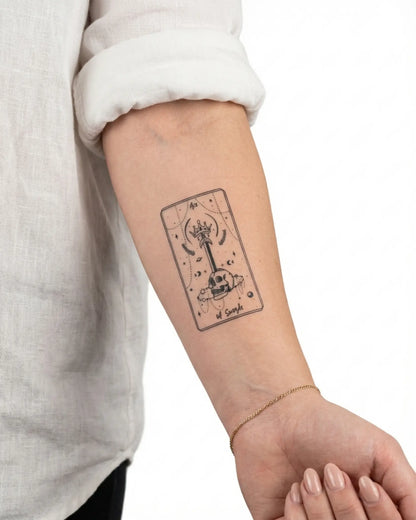 INKY Ace of Swords semi-permanent tattoo applied on a woman – 2 x 4 in (6x10 cm) design, realistic ink look, lasts 10 days