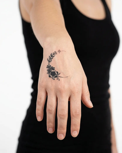 INKY Floral Moon 2 semi-permanent tattoo applied on a woman – 2 x 2 in (4x4 cm) design, realistic ink look, lasts 10 days