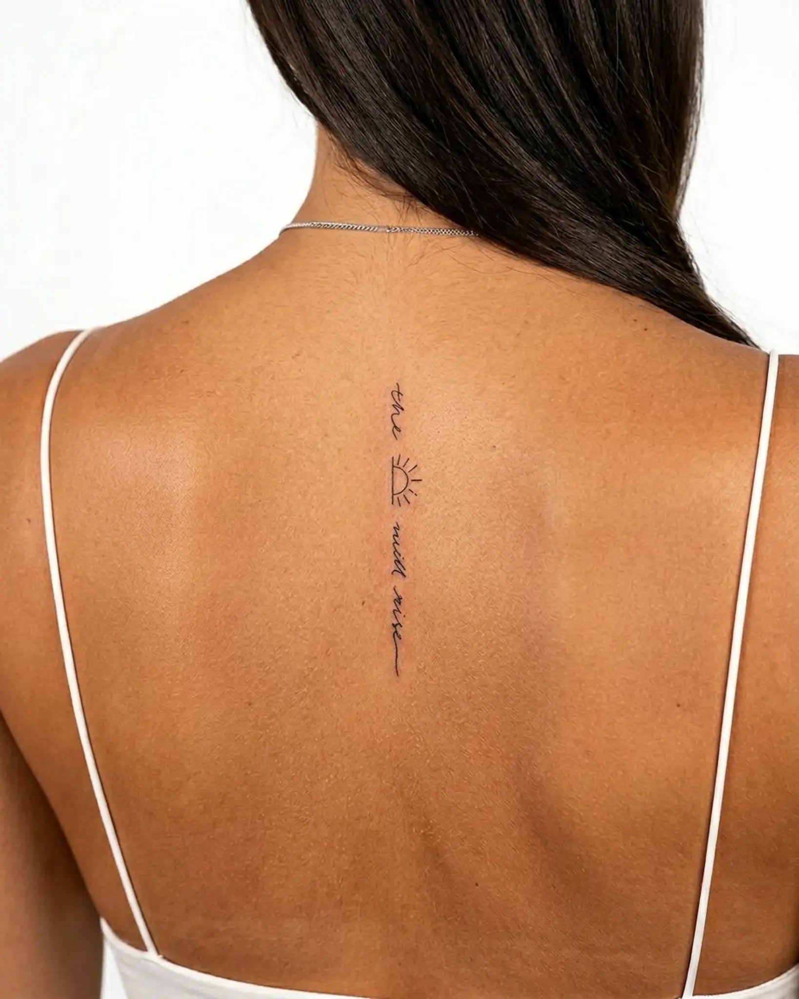 INKY Sun Will Rise semi-permanent tattoo applied on a woman – 2 x 4 in (6x10 cm) design, realistic ink look, lasts 10 days