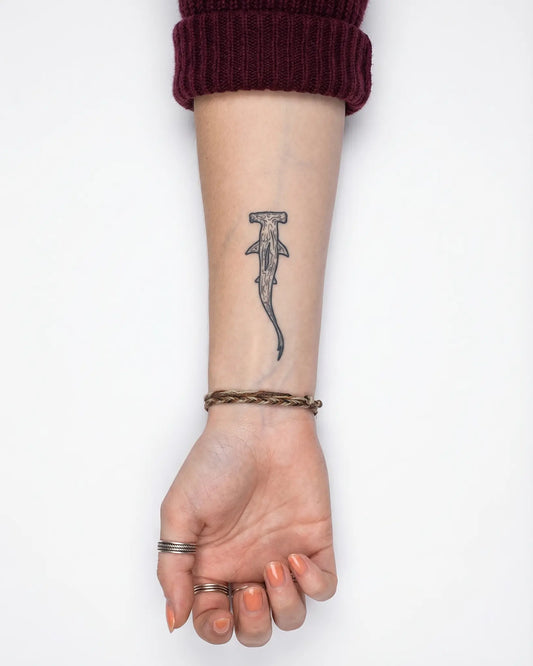 INKY Hammerhead 2 semi-permanent tattoo applied on a woman – 2 x 4 in (6x10 cm) design, realistic ink look, lasts 10 days