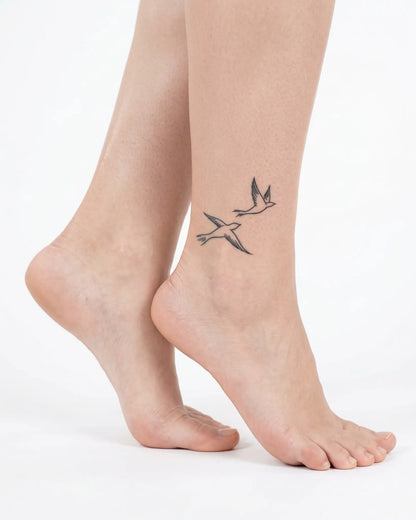 INKY Flying Birds 2 semi-permanent tattoo applied on a woman – 2 x 2 in (4x4 cm) design, realistic ink look, lasts 10 days