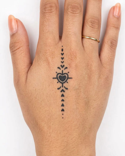 INKY Heart Stream semi-permanent tattoo applied on a woman – 2 x 2 in (4x4 cm) design, realistic ink look, lasts 10 days