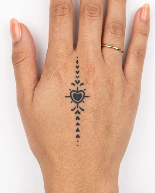 INKY Heart Stream semi-permanent tattoo applied on a woman – 2 x 2 in (4x4 cm) design, realistic ink look, lasts 10 days