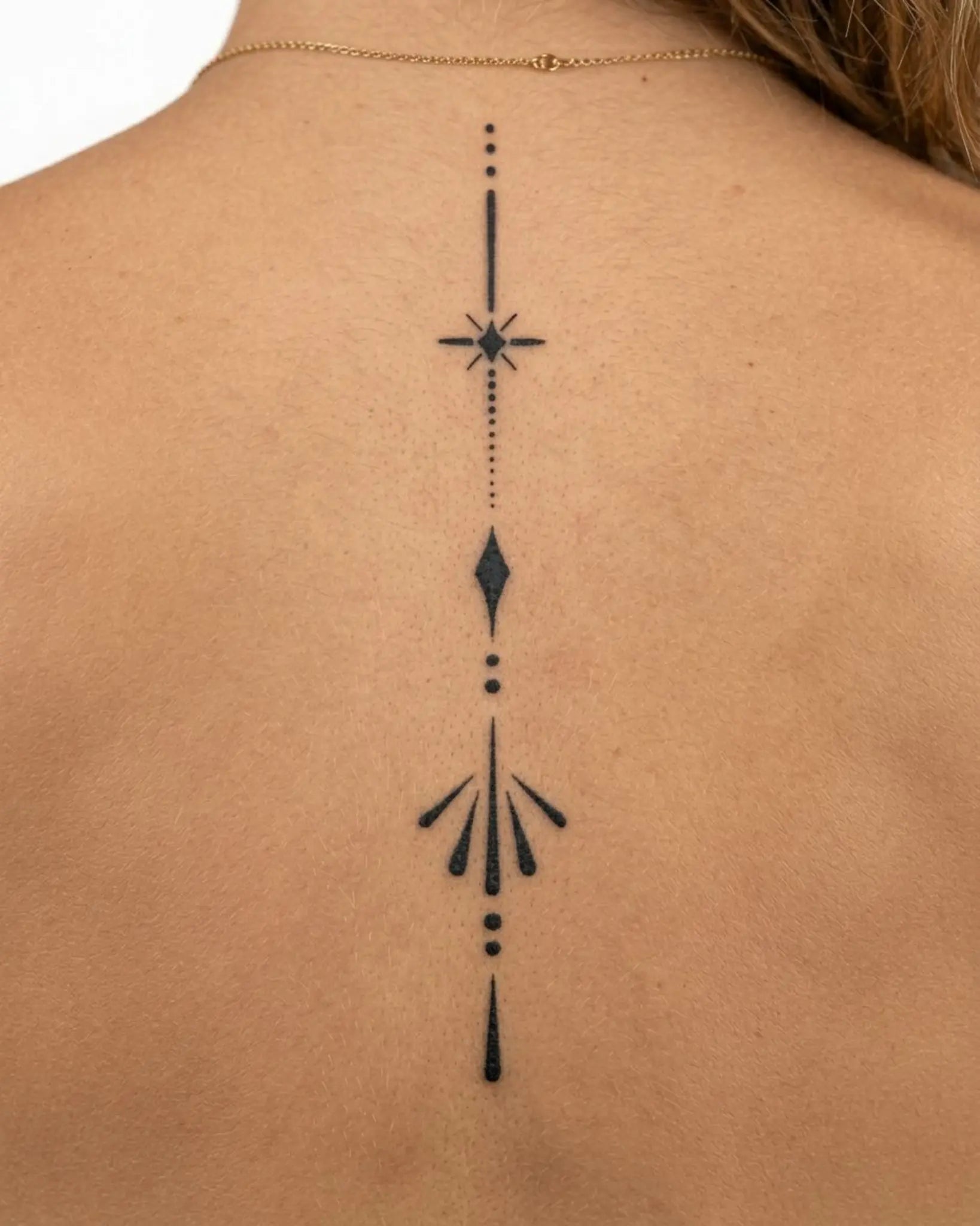 INKY Sleek Emblem 2 semi-permanent tattoo applied on a woman – 4 x 7 in (10x17 cm) design, realistic ink look, lasts 10 days