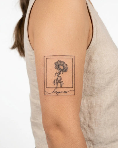 INKY Happy Sun 2 semi-permanent tattoo applied on a woman – 3 x 3 in (7x7 cm) design, realistic ink look, lasts 10 days