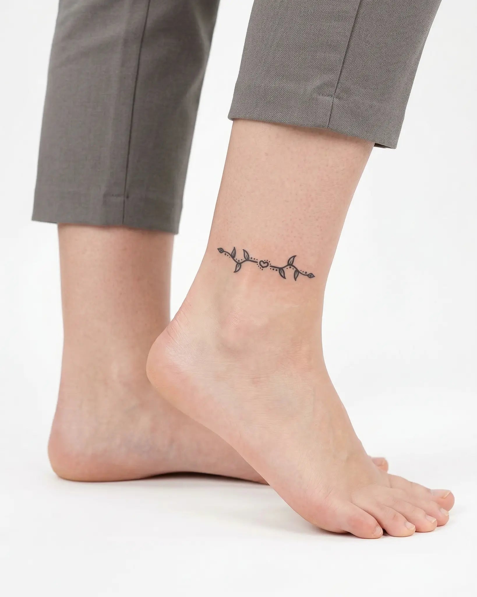 INKY Love Vine semi-permanent tattoo applied on a woman – 2 x 2 in (4x4 cm) design, realistic ink look, lasts 10 days