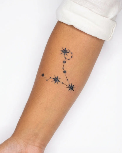 INKY Pisces Star semi-permanent tattoo applied on a woman – 3 x 3 in (7x7 cm) design, realistic ink look, lasts 10 days
