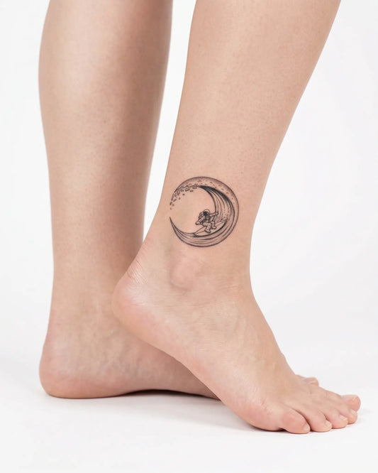 INKY Astro Surf semi-permanent tattoo applied on a woman – 2 x 2 in (4x4 cm) design, realistic ink look, lasts 10 days