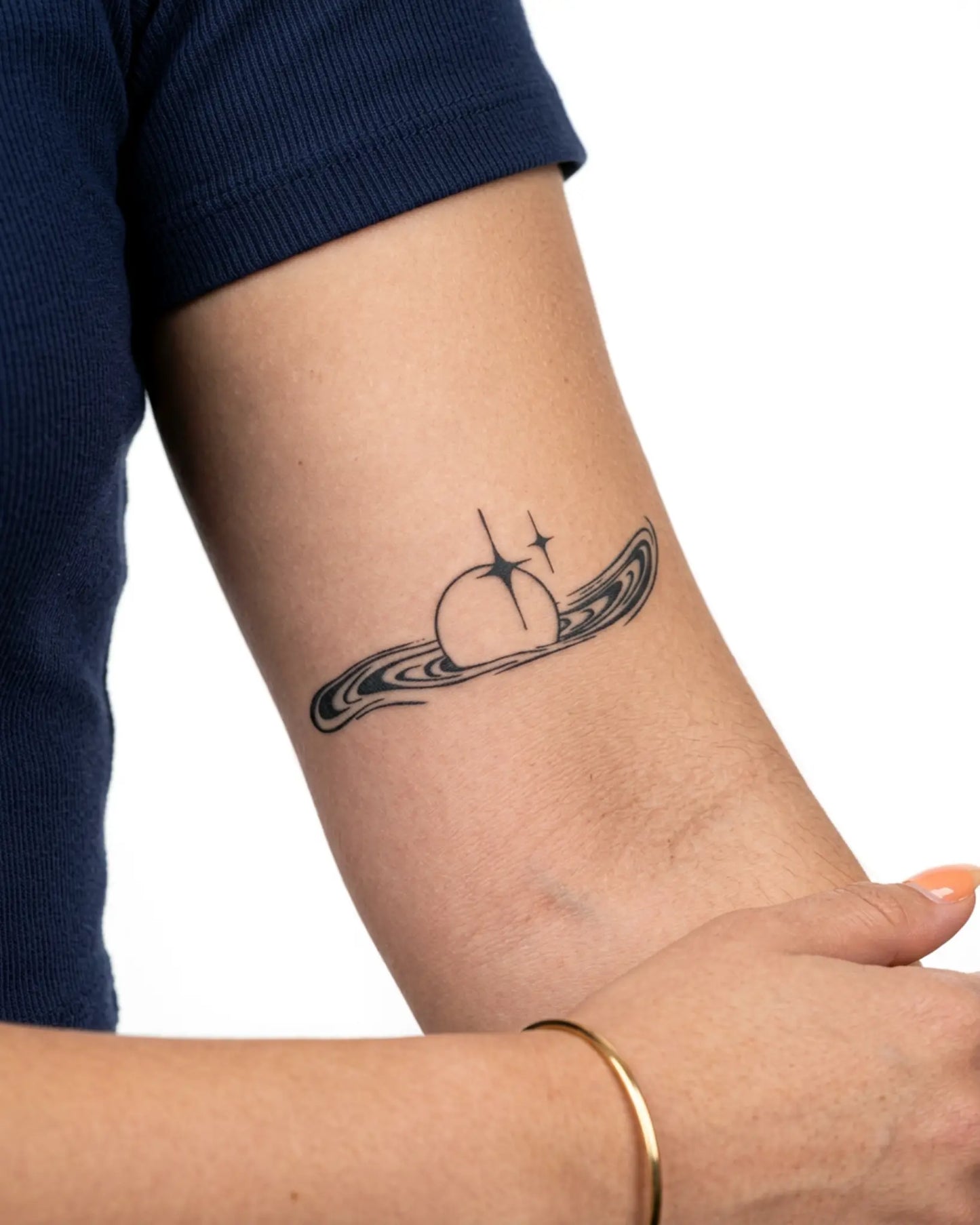 INKY Sparkle Orb semi-permanent tattoo applied on a woman – 2 x 4 in (6x10 cm) design, realistic ink look, lasts 10 days