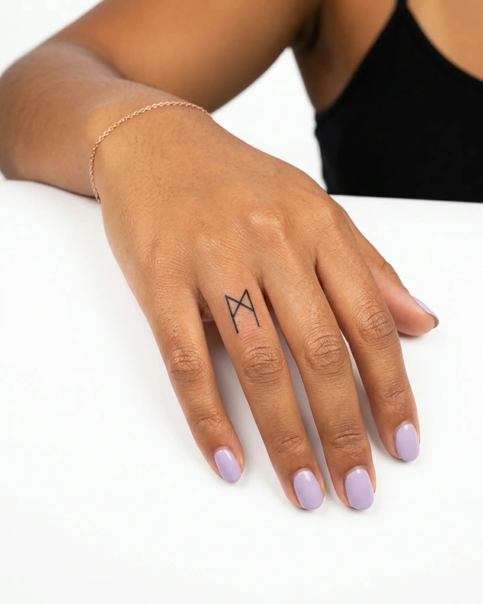 INKY Algiz Rune 3 semi-permanent tattoo applied on a woman – 0.5 x 0.5 in (1x1 cm) design, realistic ink look, lasts 10 days