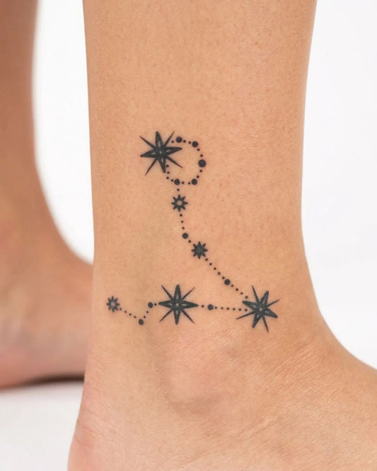 INKY Pisces Star 2 semi-permanent tattoo applied on a woman – 2 x 2 in (4x4 cm) design, realistic ink look, lasts 10 days
