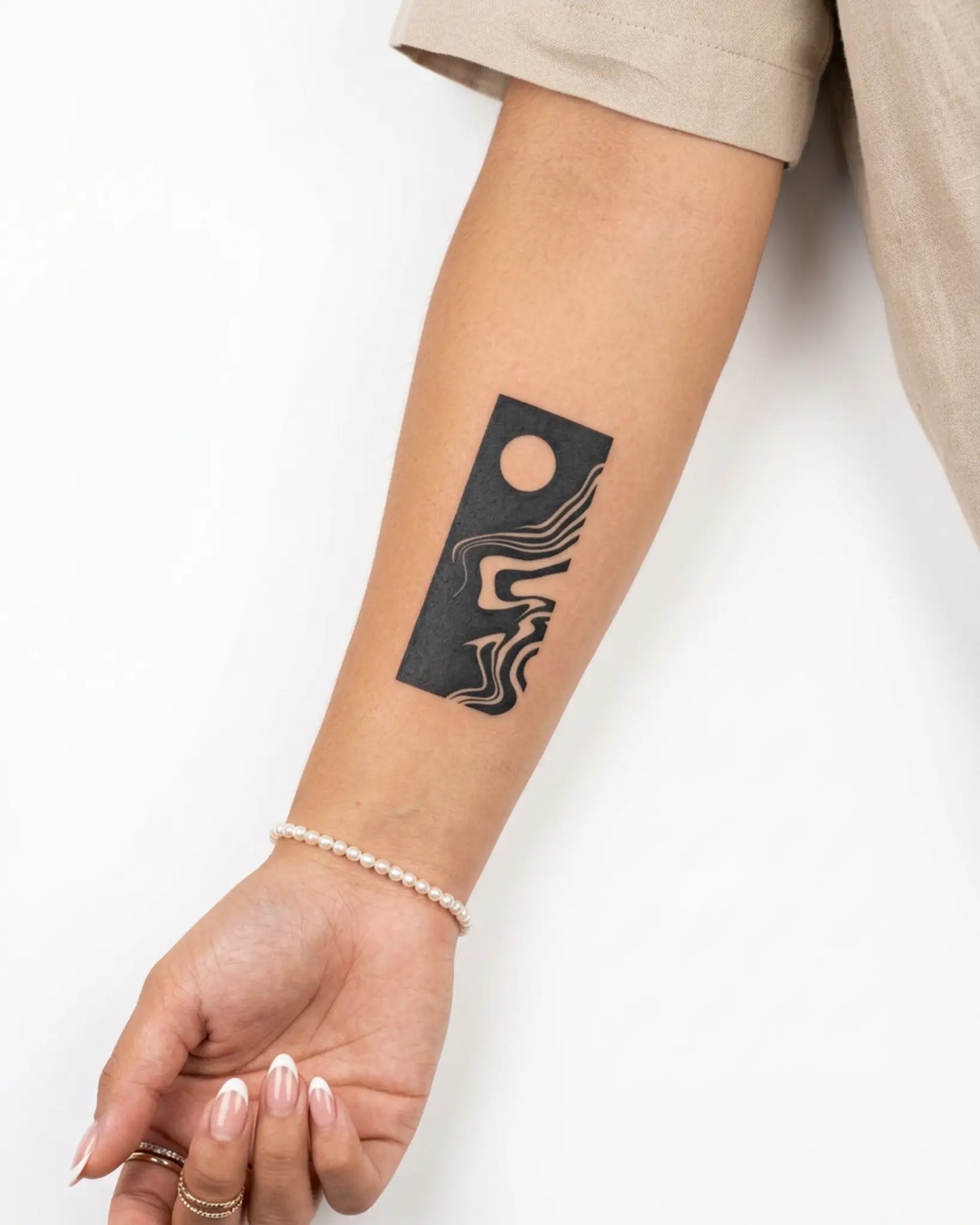 INKY Moon Flow semi-permanent tattoo applied on a woman – 2 x 4 in (6x10 cm) design, realistic ink look, lasts 10 days