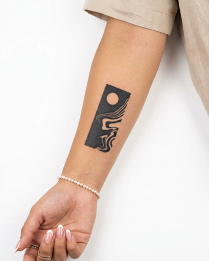 INKY Moon Flow semi-permanent tattoo applied on a woman – 2 x 4 in (6x10 cm) design, realistic ink look, lasts 10 days