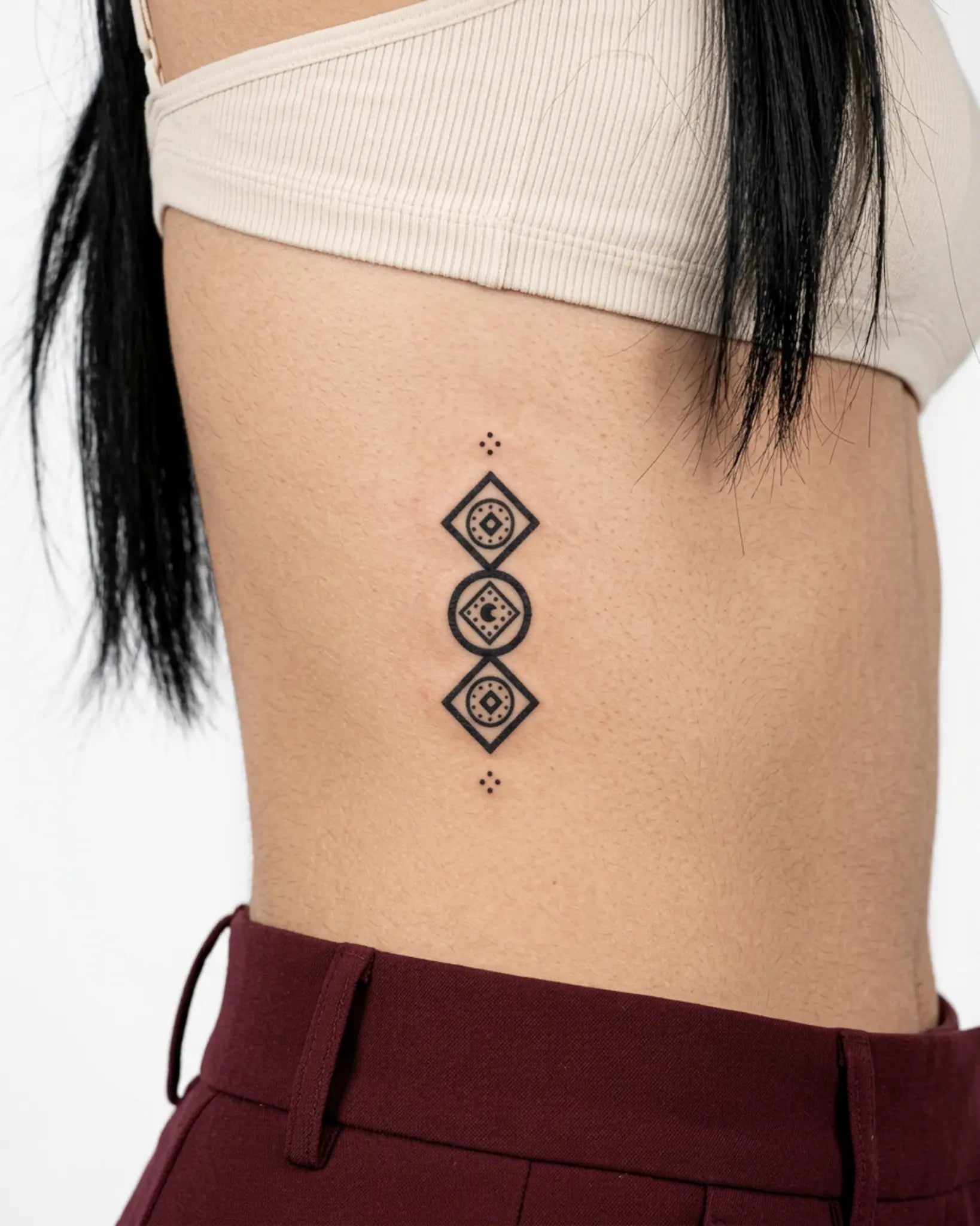 INKY Geo Stack semi-permanent tattoo applied on a woman – 2 x 4 in (6x10 cm) design, realistic ink look, lasts 10 days