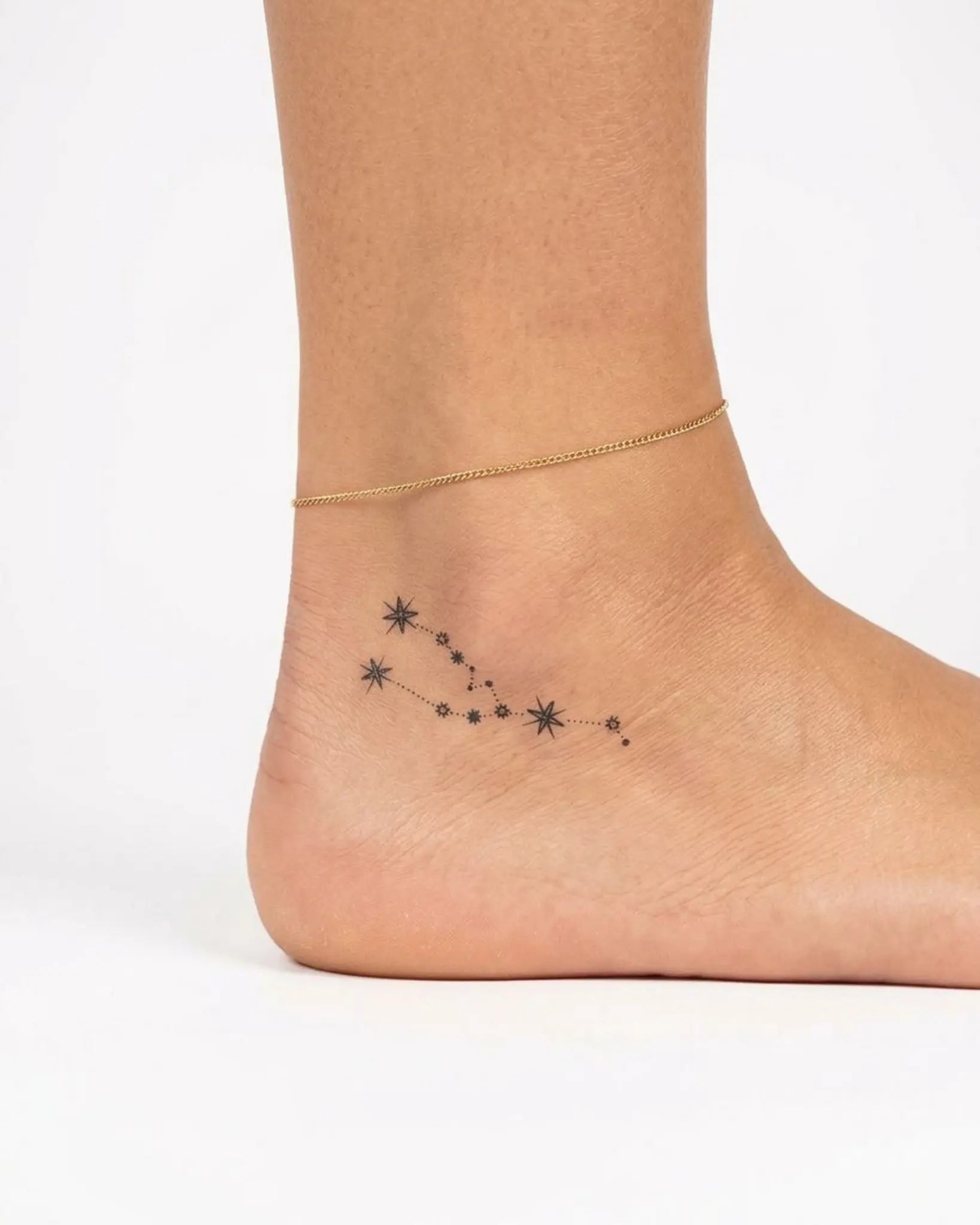 INKY Taurus Star semi-permanent tattoo applied on a woman – 2 x 2 in (4x4 cm) design, realistic ink look, lasts 10 days