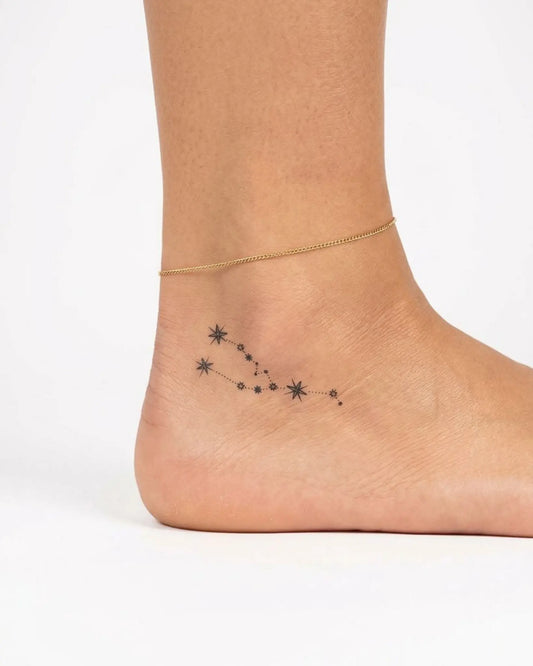 INKY Taurus Star semi-permanent tattoo applied on a woman – 2 x 2 in (4x4 cm) design, realistic ink look, lasts 10 days