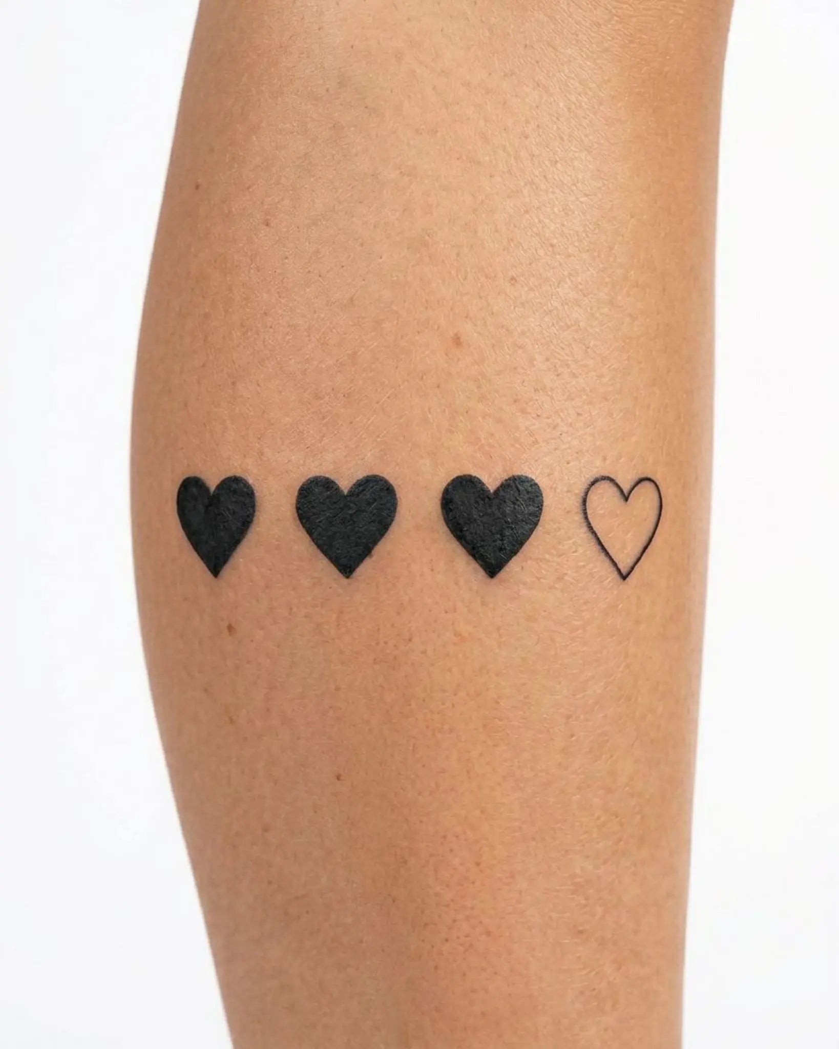 INKY Heart Set semi-permanent tattoo applied on a woman – 3 x 3 in (7x7 cm) design, realistic ink look, lasts 10 days