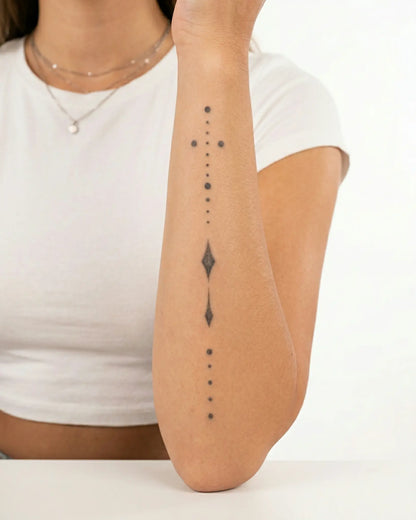 INKY Spirit Line 3 semi-permanent tattoo applied on a woman – 4 x 7 in (10x17 cm) design, realistic ink look, lasts 10 days