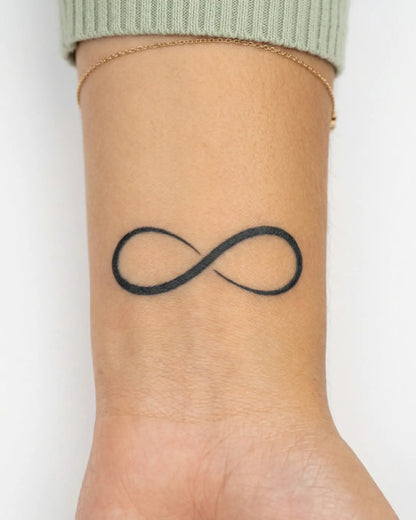 INKY Infinity semi-permanent tattoo applied on a woman – 2 x 2 in (4x4 cm) design, realistic ink look, lasts 10 days