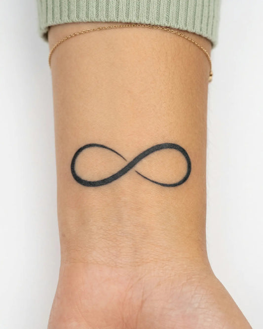 INKY Infinity semi-permanent tattoo applied on a woman – 2 x 2 in (4x4 cm) design, realistic ink look, lasts 10 days