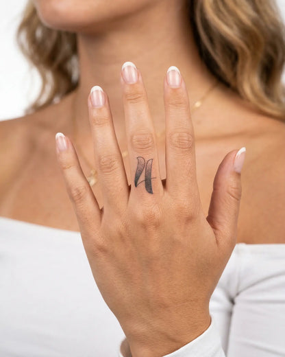 INKY Stipple Four semi-permanent tattoo applied on a woman – 0.5 x 0.5 in (1x1 cm) design, realistic ink look, lasts 10 days