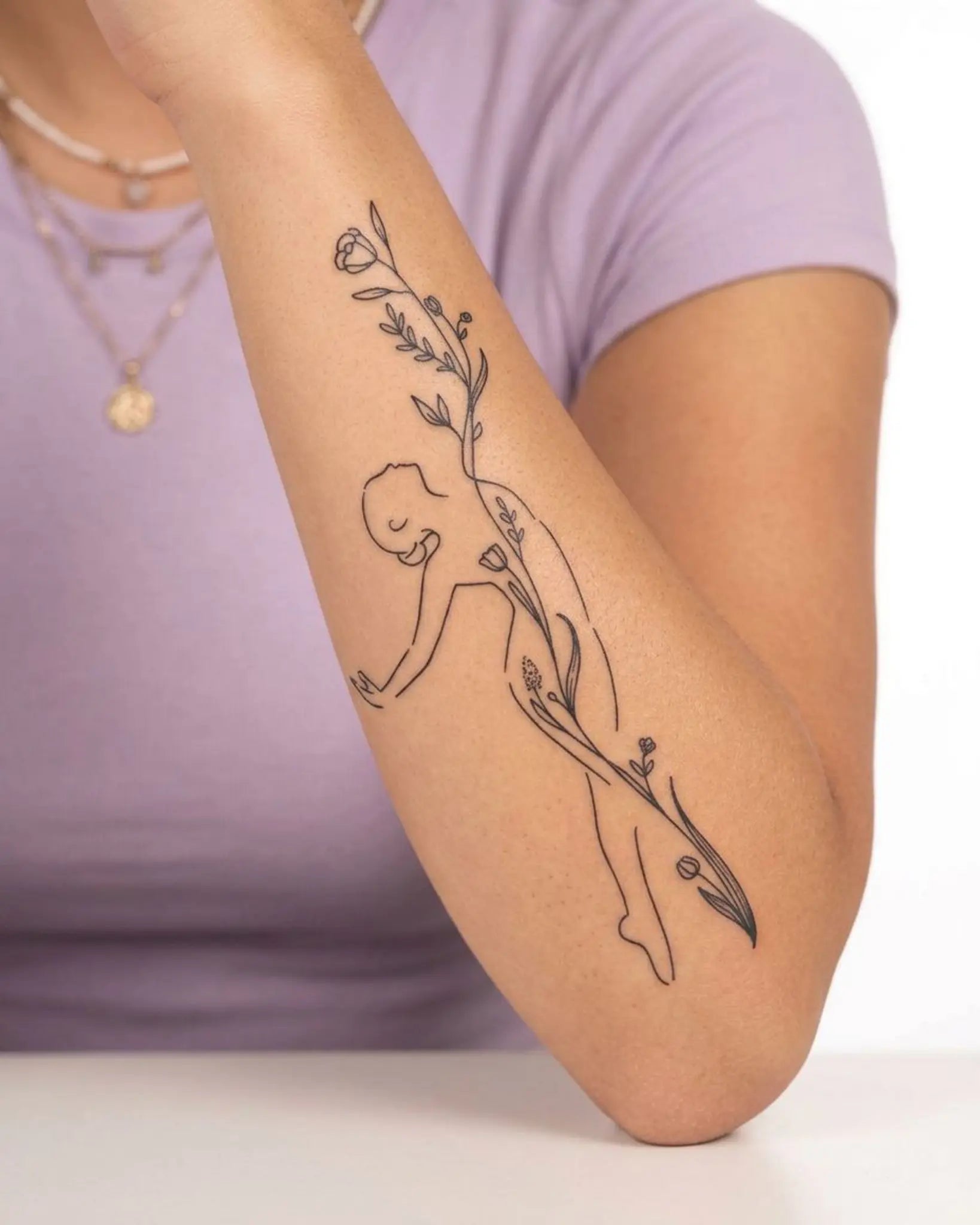 INKY Bloom Form 2 semi-permanent tattoo applied on a woman – 4 x 7 in (10x17 cm) design, realistic ink look, lasts 10 days