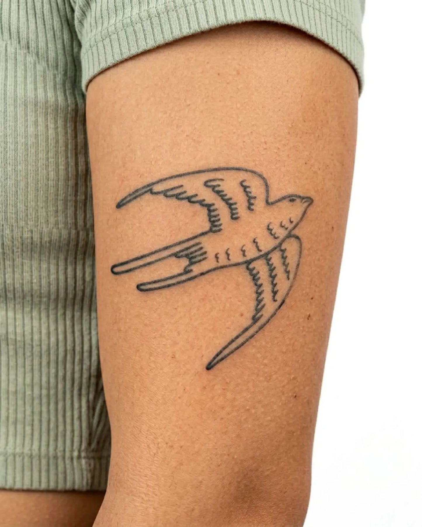 INKY Flying Bird 3 semi-permanent tattoo applied on a woman – 3 x 3 in (7x7 cm) design, realistic ink look, lasts 10 days