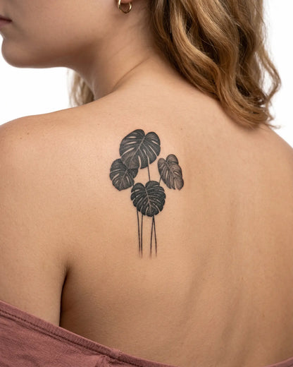 INKY Monstera Art semi-permanent tattoo applied on a woman – 2 x 4 in (6x10 cm) design, realistic ink look, lasts 10 days