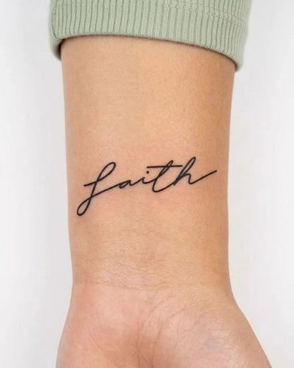 INKY Faith semi-permanent tattoo applied on a woman – 2 x 2 in (4x4 cm) design, realistic ink look, lasts 10 days