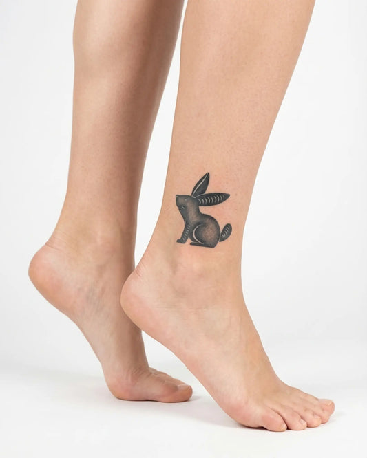 INKY Black Rabbit semi-permanent tattoo applied on a woman – 2 x 2 in (4x4 cm) design, realistic ink look, lasts 10 days