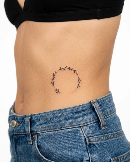 INKY Leaf Wreath 2 semi-permanent tattoo applied on a woman – 3 x 3 in (7x7 cm) design, realistic ink look, lasts 10 days