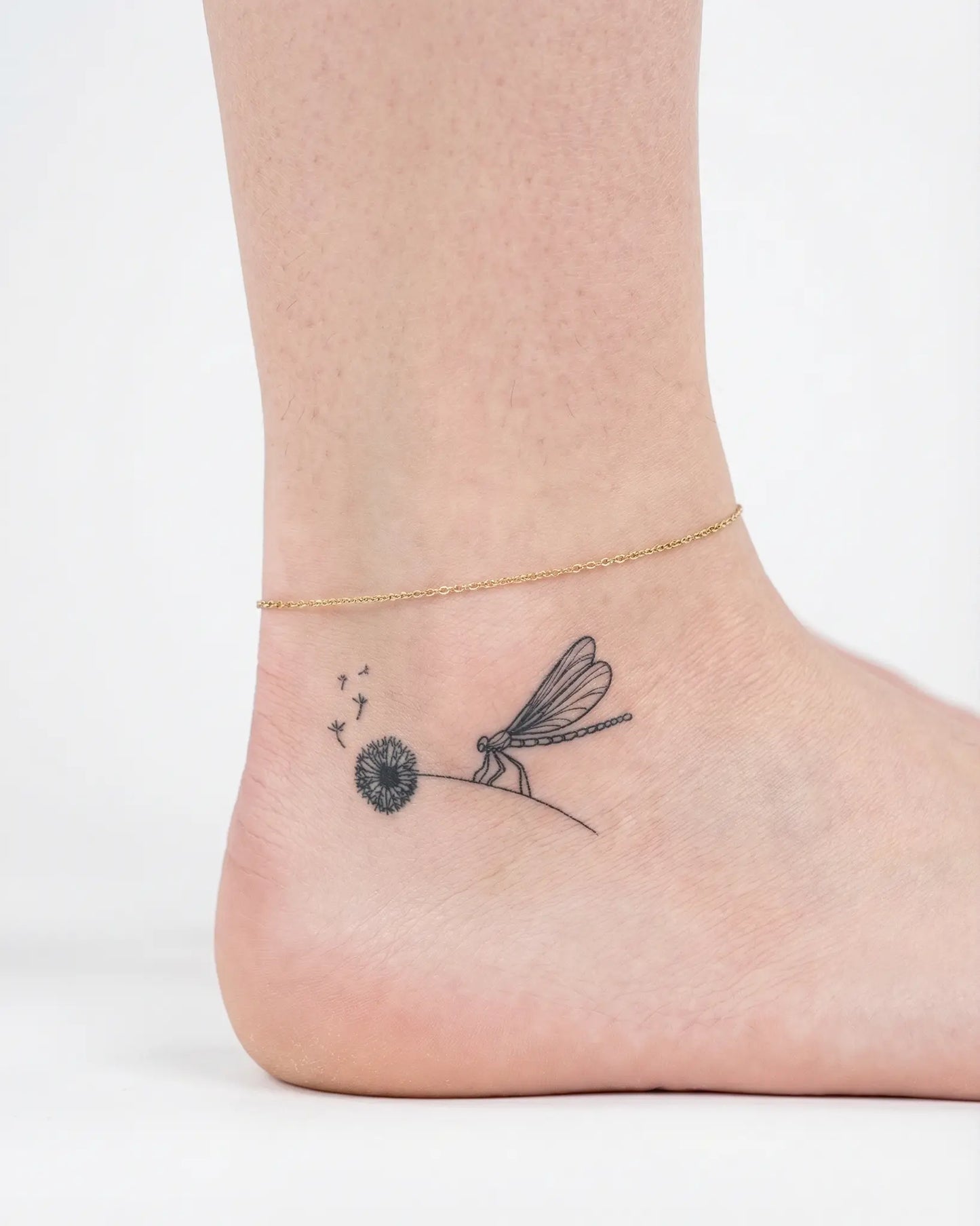 INKY Wishful Fligh 2 semi-permanent tattoo applied on a woman – 2 x 2 in (4x4 cm) design, realistic ink look, lasts 10 days