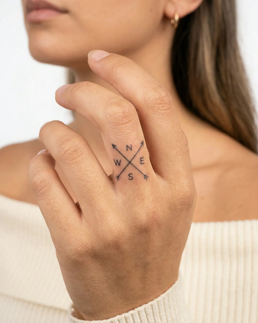 INKY NSEW Arrows semi-permanent tattoo applied on a woman – 0.5 x 0.5 in (1x1 cm) design, realistic ink look, lasts 10 days