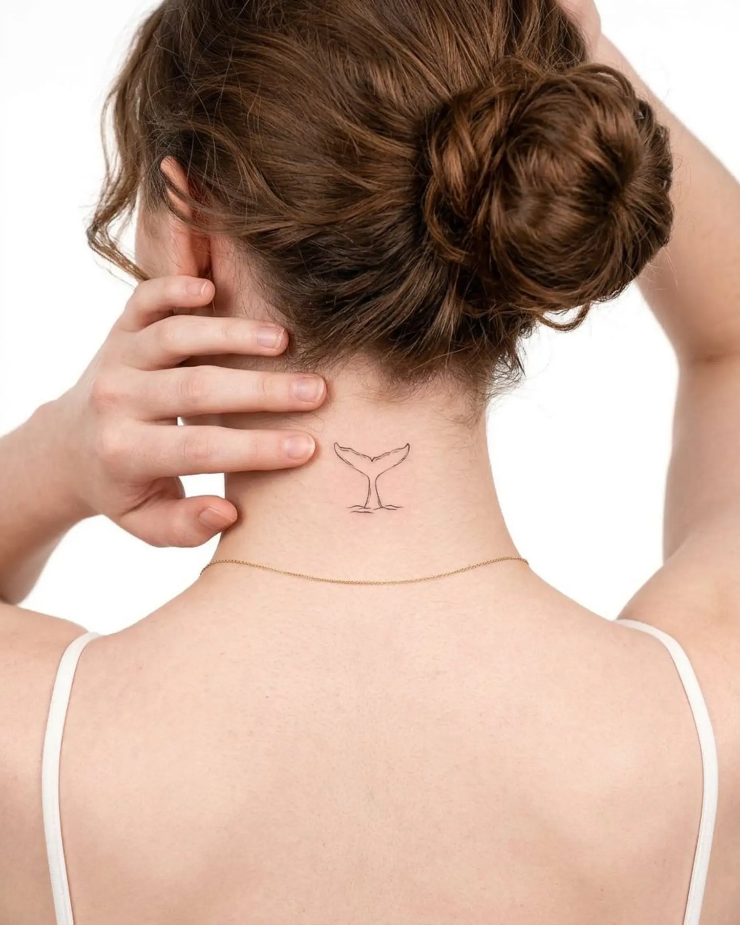 INKY Tail Dive semi-permanent tattoo applied on a woman – 2 x 2 in (4x4 cm) design, realistic ink look, lasts 10 days