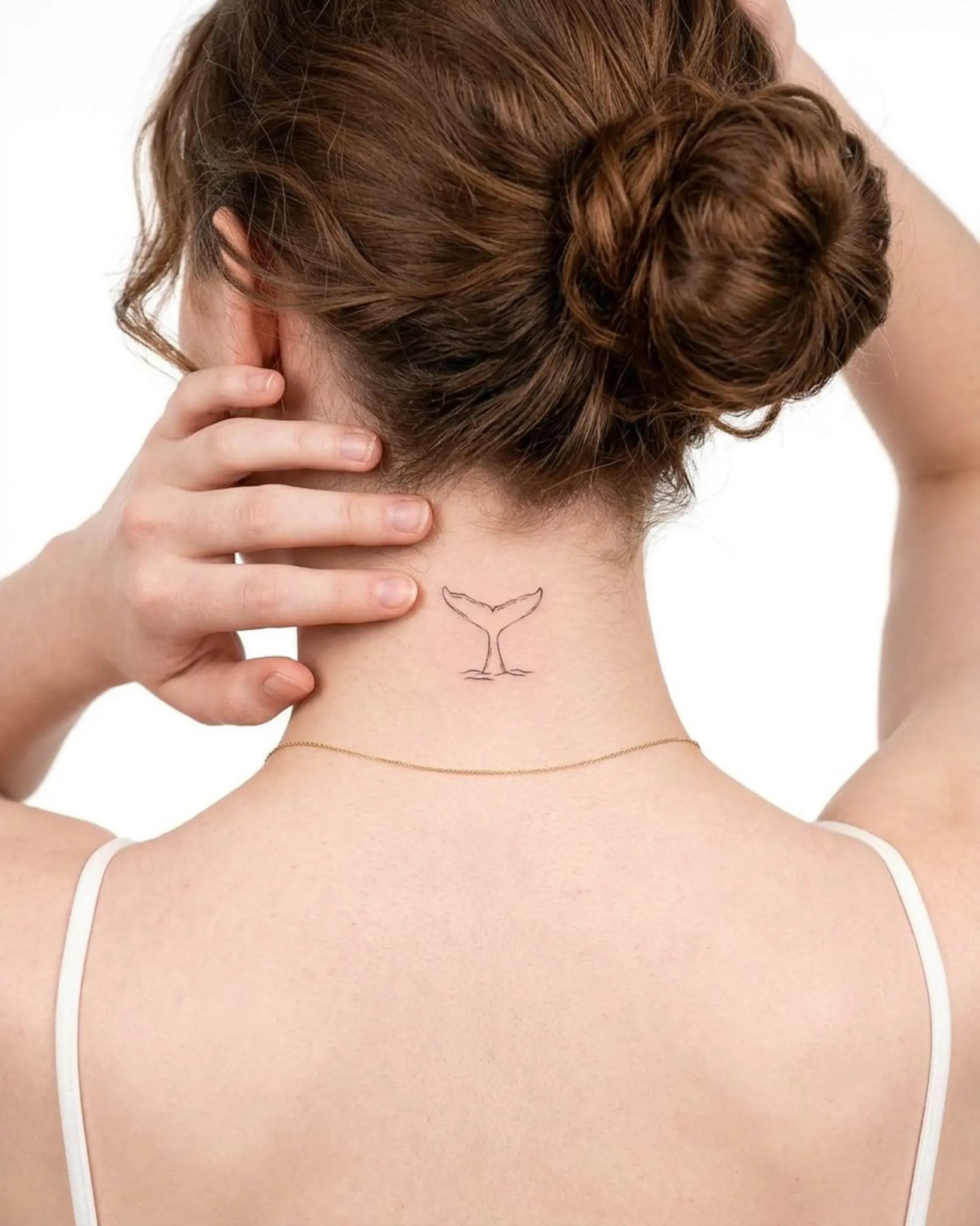 INKY Tail Dive semi-permanent tattoo applied on a woman – 2 x 2 in (4x4 cm) design, realistic ink look, lasts 10 days