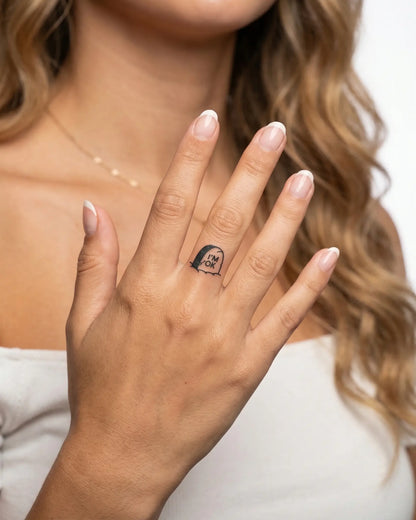 INKY OK Grave semi-permanent tattoo applied on a woman – 0.5 x 0.5 in (1x1 cm) design, realistic ink look, lasts 10 days
