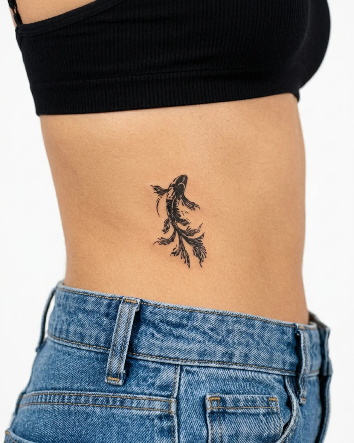 INKY Black Koi semi-permanent tattoo applied on a woman – 3 x 3 in (7x7 cm) design, realistic ink look, lasts 10 days