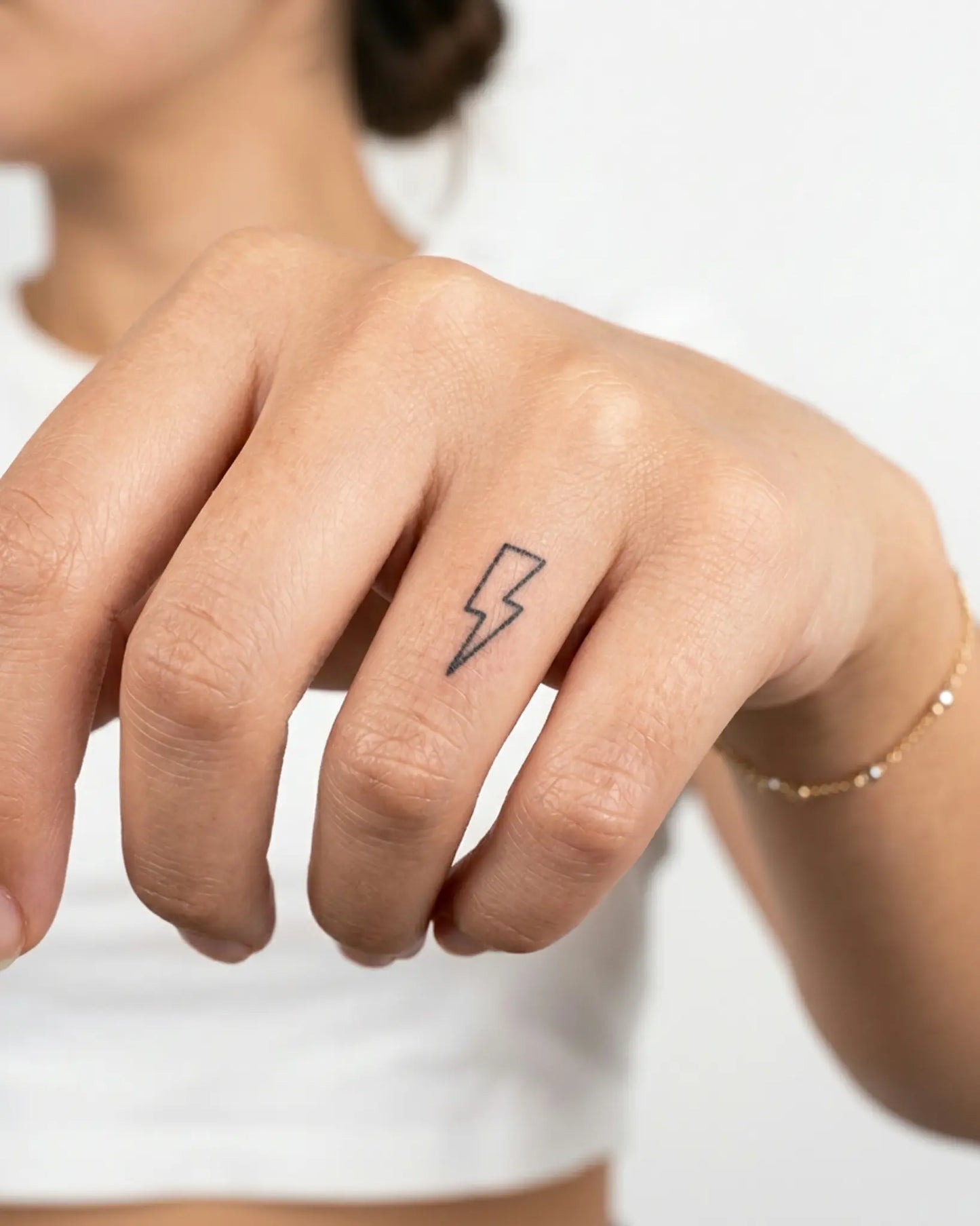 INKY Lightning 2 semi-permanent tattoo applied on a woman – 0.5 x 0.5 in (1x1 cm) design, realistic ink look, lasts 10 days