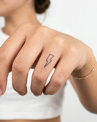 INKY Lightning 2 semi-permanent tattoo applied on a woman – 0.5 x 0.5 in (1x1 cm) design, realistic ink look, lasts 10 days