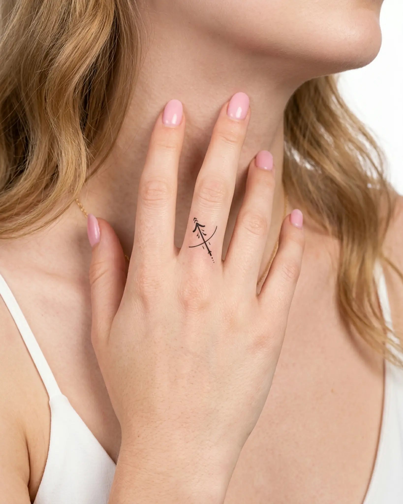 INKY Scorpio 2 semi-permanent tattoo applied on a woman – 0.5 x 0.5 in (1x1 cm) design, realistic ink look, lasts 10 days