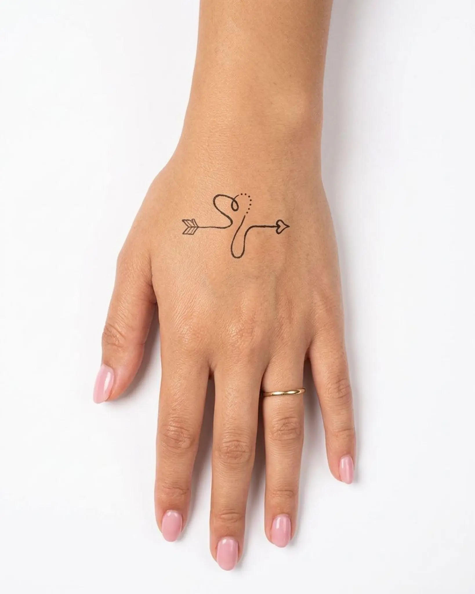 INKY S Heart Bow 2 semi-permanent tattoo applied on a woman – 2 x 2 in (4x4 cm) design, realistic ink look, lasts 10 days