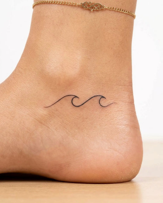 INKY Wave Line semi-permanent tattoo applied on a woman – 2 x 2 in (4x4 cm) design, realistic ink look, lasts 10 days