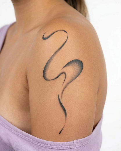 INKY Flow Line semi-permanent tattoo applied on a woman – 4 x 7 in (10x17 cm) design, realistic ink look, lasts 10 days