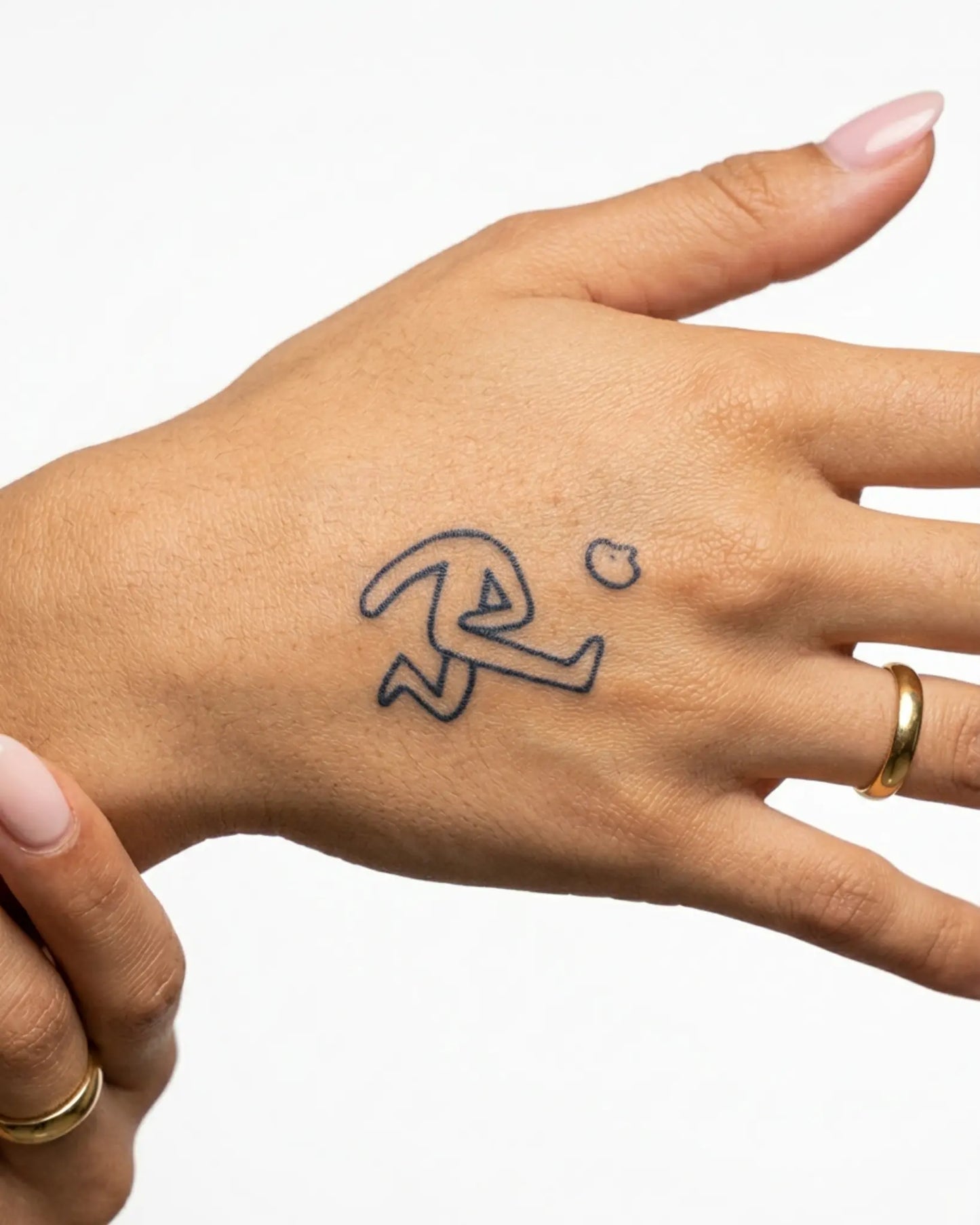 INKY Dash semi-permanent tattoo applied on a woman – 2 x 2 in (4x4 cm) design, realistic ink look, lasts 10 days